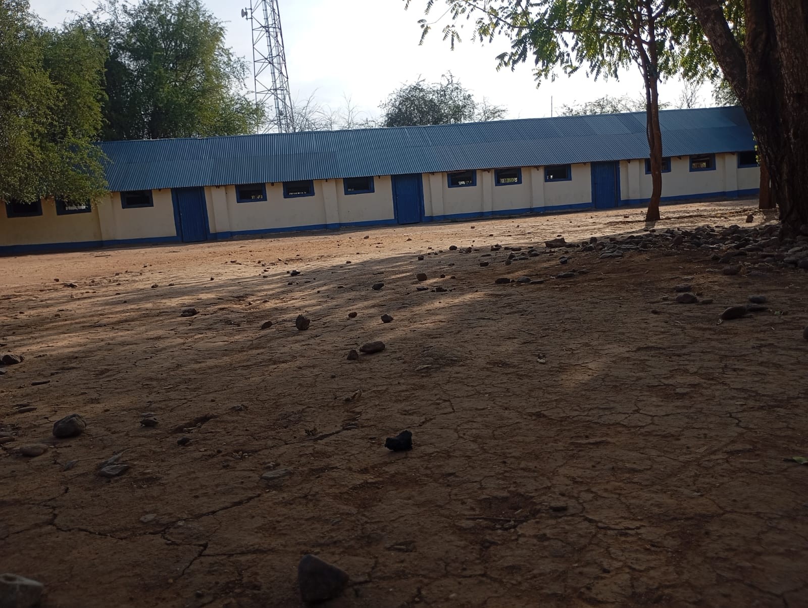 Classroom block and open compound supporting daily learning.