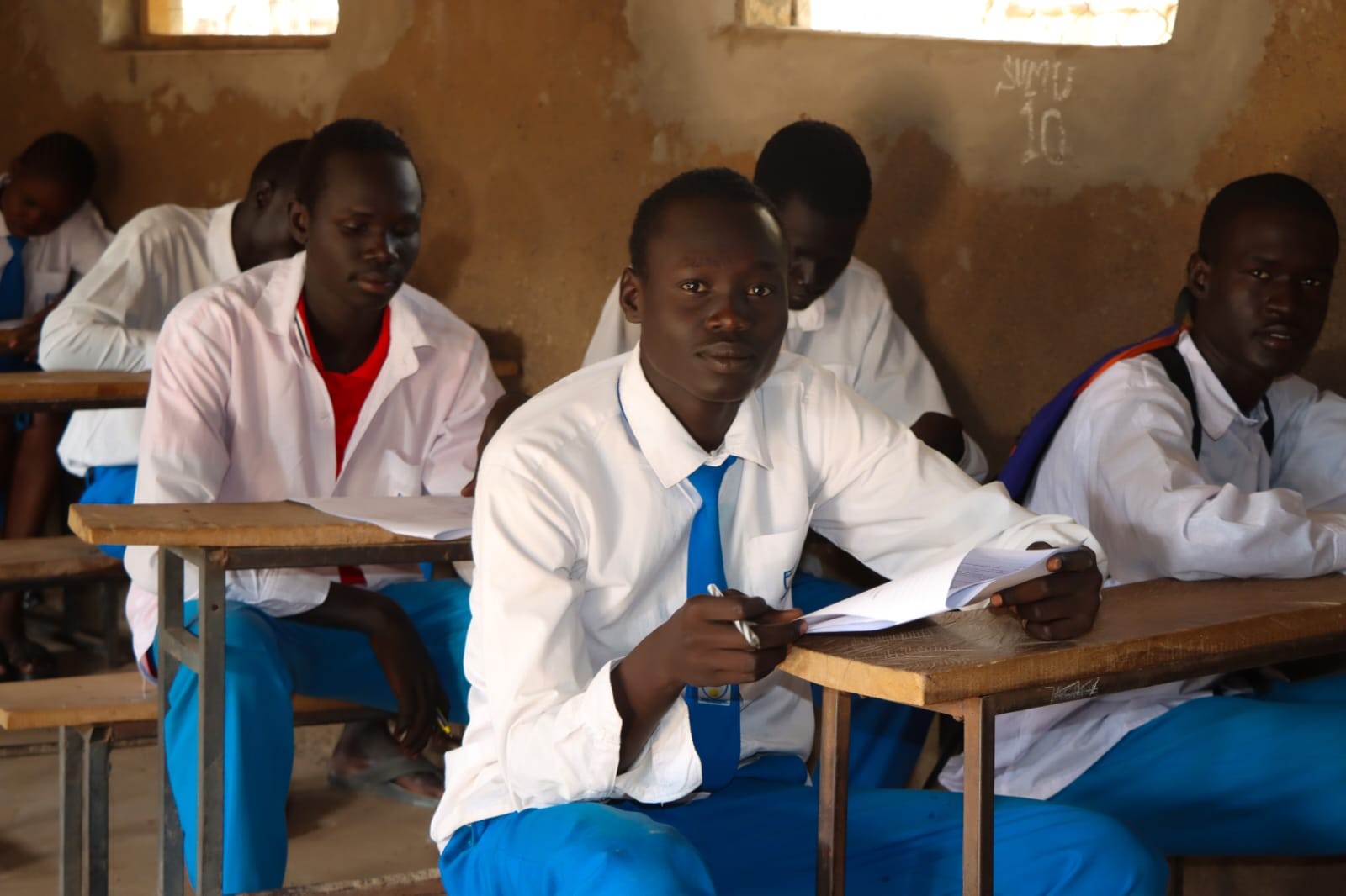 Learners participating in classroom study and revision.