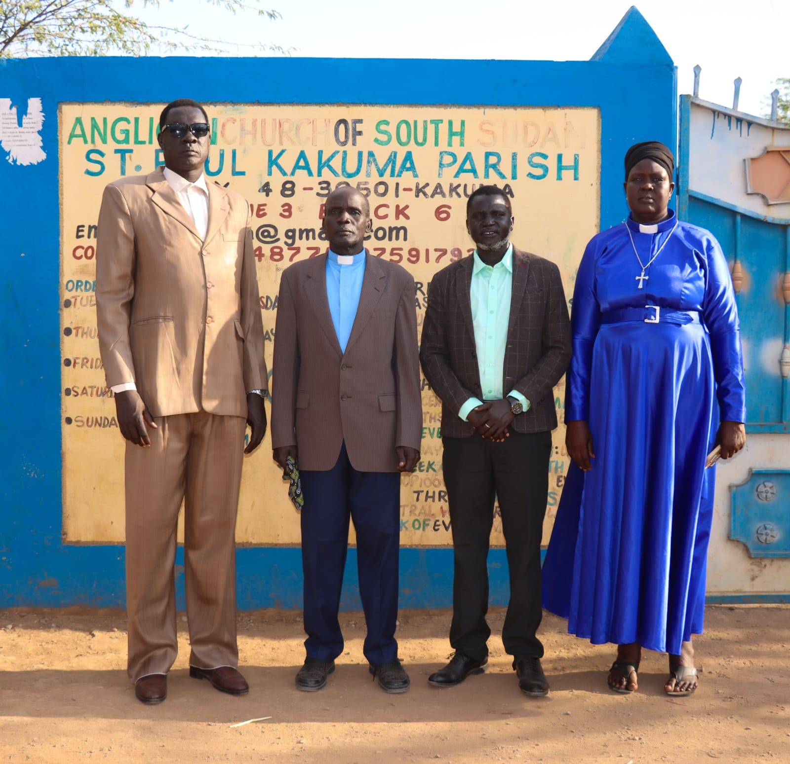 Members of Management Board at St. Paul’s Kakuma Parish entrance.
