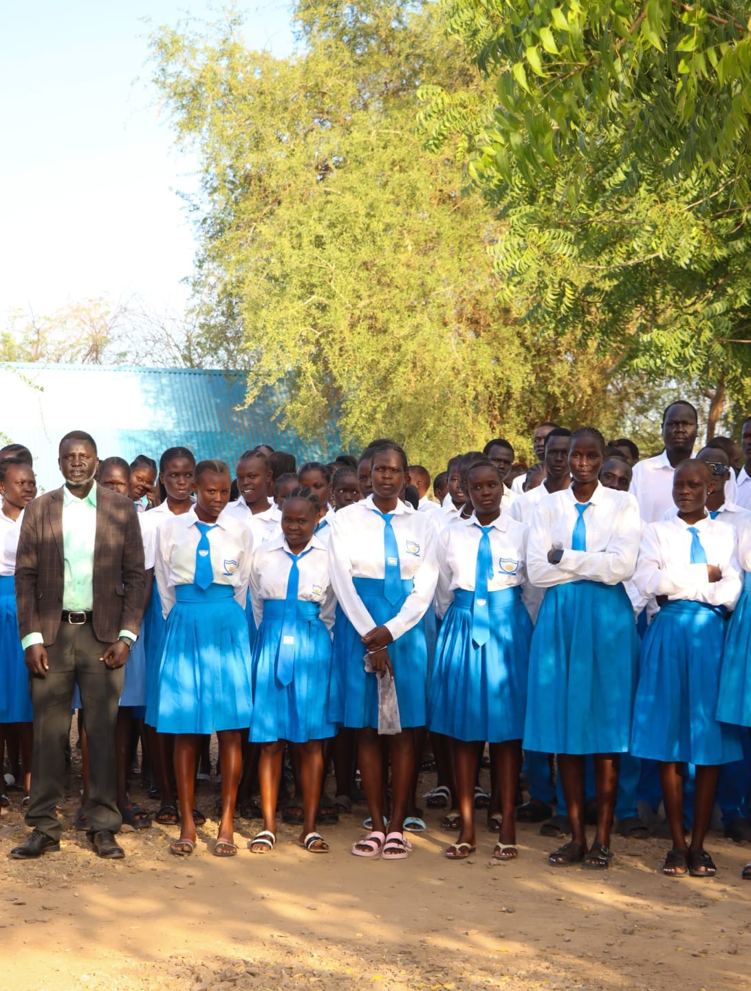 Students assembled with staff during a school activity.