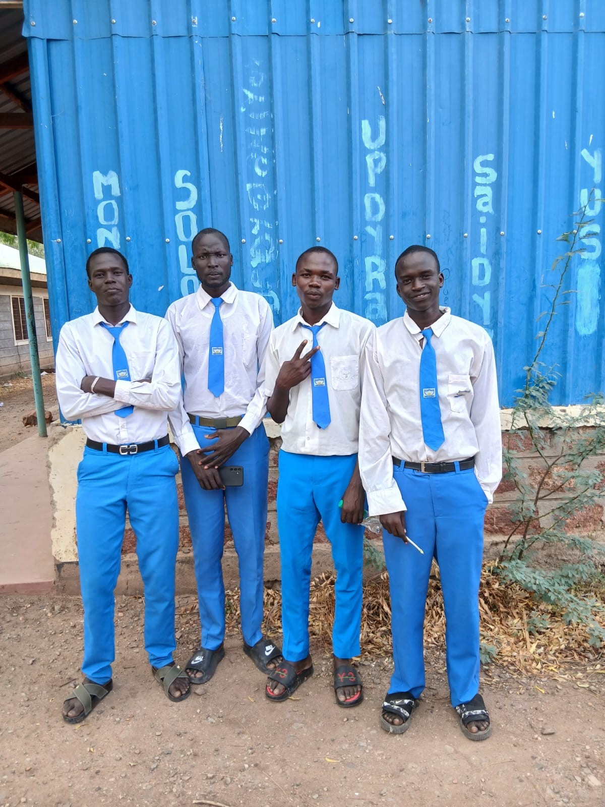 Students in school uniform standing together at St. Paul's Kakuma Secondary School
